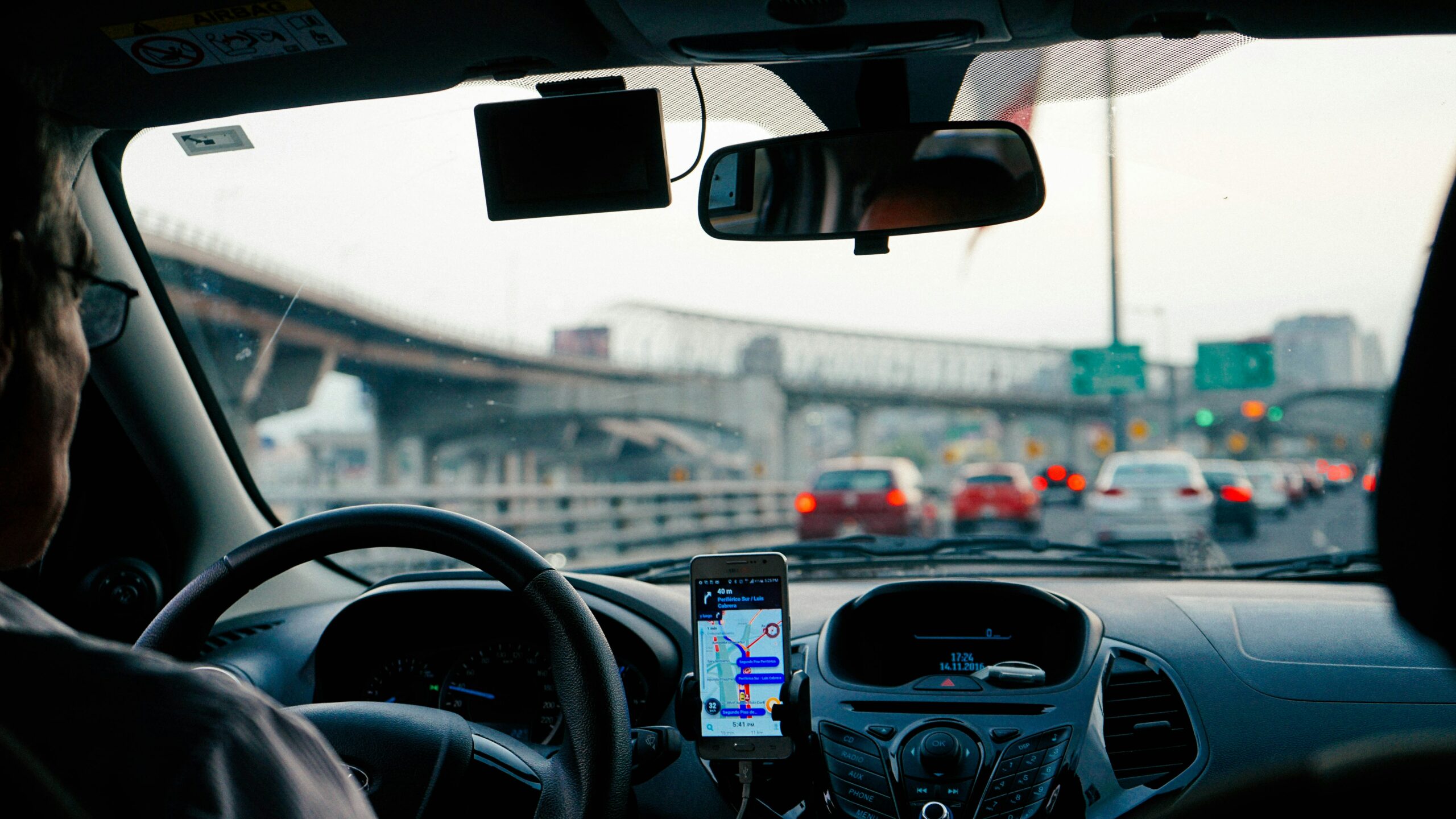 A view of a car from the back seat. A typical view in rideshares.